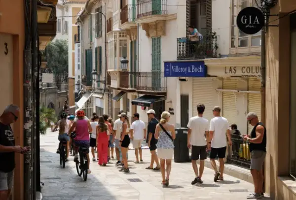 Tourists in Palma de Mallorca, Spain, on Sunday, July 26, 2026. Together, surging tourist numbers and the impacts of climate change are putting unprecedented stress on the ecosystems, economies and societies that support the industry, calling into question the business models that have sustained it for decades.??Photographer: Andrey Rudakov/Bloomberg via Getty Images