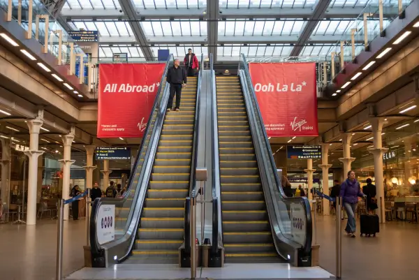 LONDON, UNITED KINGDOM - 2025/10/30: New Virgin Trains' banners hang over the travelers on the St Pancras International railway station in London. Virgin Trains announced it is planning to challenge Eurostar and to launch rail services from London St Pancras to Europe from 2030. The company hung banners to promote this on St Pancras train station. (Photo by Krisztian Elek/SOPA Images/LightRocket via Getty Images)