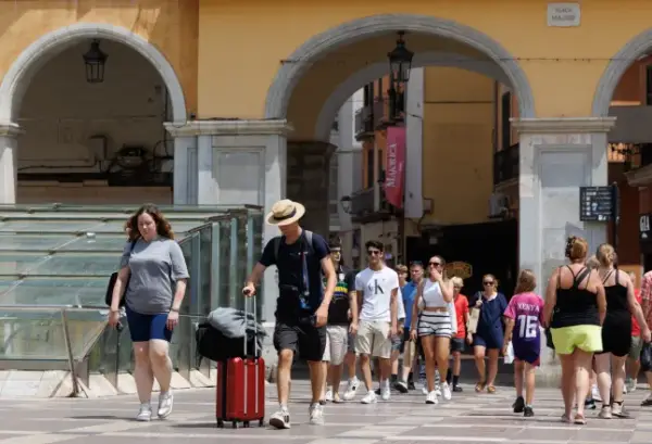 Tourists in Palma de Mallorca, Spain, on Sunday, July 26, 2026. Together, surging tourist numbers and the impacts of climate change are putting unprecedented stress on the ecosystems, economies and societies that support the industry, calling into question the business models that have sustained it for decades.??Photographer: Andrey Rudakov/Bloomberg via Getty Images