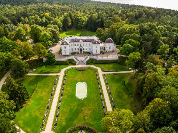 The exterior of Tiskeviciai Palace in Palanga, Lithuania, set within the lush green Birute Park.