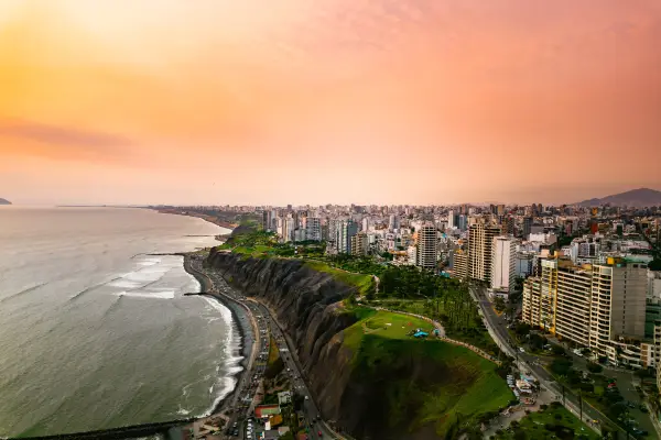 At sunset in Lima, the cliffs of Miraflores look beautiful overlooking the Pacific Ocean (Picture: Getty Images)