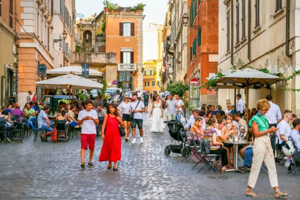 Коли друзі приїжджають до Рима: куди їх запросити 8 Rome, Italy, July 22 -- Dozens of customer and young adults enjoy life sitting in some outdoor pubs and restaurants in Piazza della Madonna Dei Monti, a picturesque small square in the Rione Monti (Monti district), in the heart of the historic center of Rome. The Monti district is a popular and multi-ethnic quarter much loved by the younger generations and tourists for the presence of trendy pubs, fashion shops and restaurants, where you can find the true soul of the Eternal City. This district, located between the Esquiline Hill and the Roman Forum, is also rich in numerous Baroque-style churches and archaeological remains from the Roman era. In 1980 the historic center of Rome was declared a World Heritage Site by Unesco. Image in high definition format.