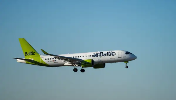 Varese, Italy. February 24, 2025. AirBaltic Airbus A220 airplane is Landing at MXP Milano Malpensa international airport; Shutterstock ID 2591551967; purchase_order: -; job: -; client: -; other: