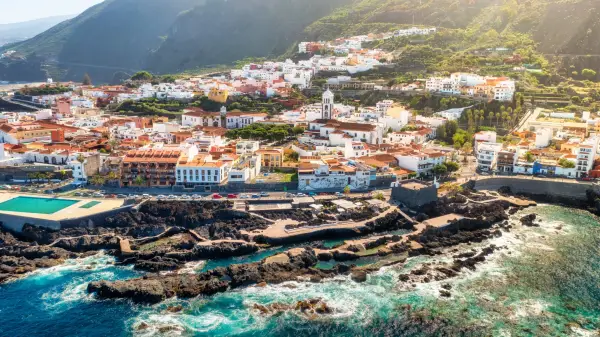 An aerial view of Garachico in northern Tenerife, looking over the sea, coast and town.