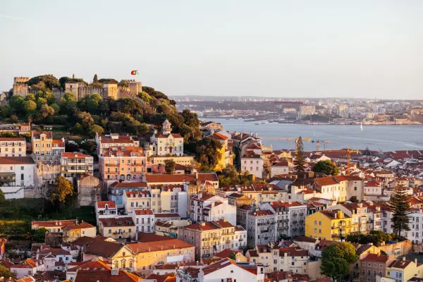 A cityscape of Lisbon, Portugal, sweeping over colourful buildings.