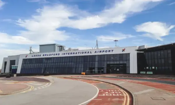 Yeadon, UK - April 16, 2014: External view of the Leeds Bradford international airport on the West Yorkshire. This airport is situated in Yeadon on the metropolitan area of Leeds, it's an Hub for Ryanair, Transavia and Jet2. Image taken in the afternoon on a cloudy day.