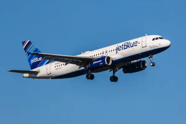 New York, USA - April 30, 2012: Airbus A320 JetBlue approaches John F. Kennedy International Airport in New York, NY on April 30, 2012. The A320 was the first narrow body airliner from Airbus. It is the biggest competition to Boeing 737NG.